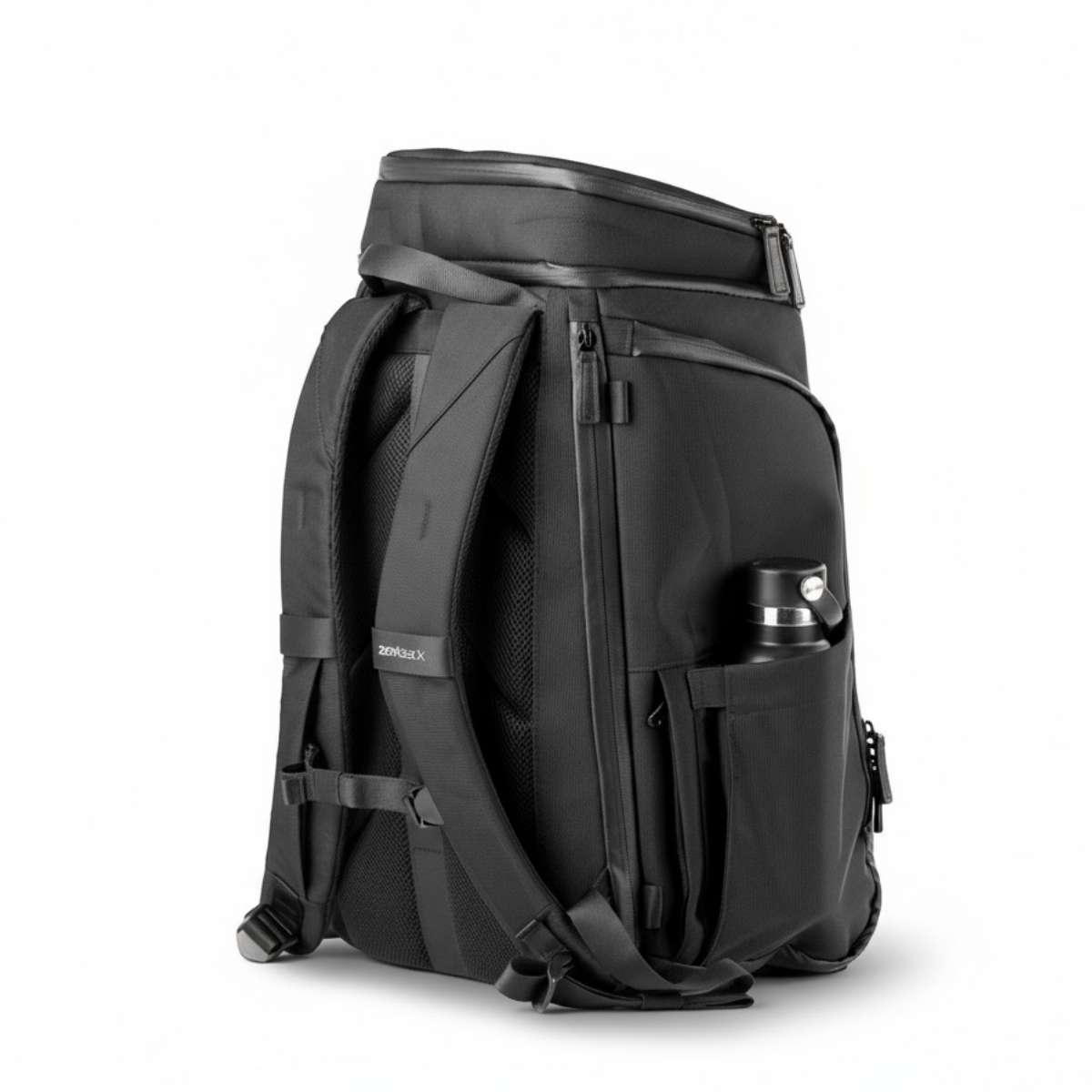 Black backpack viewed from the side with closed compartments and a water bottle in the side pocket.