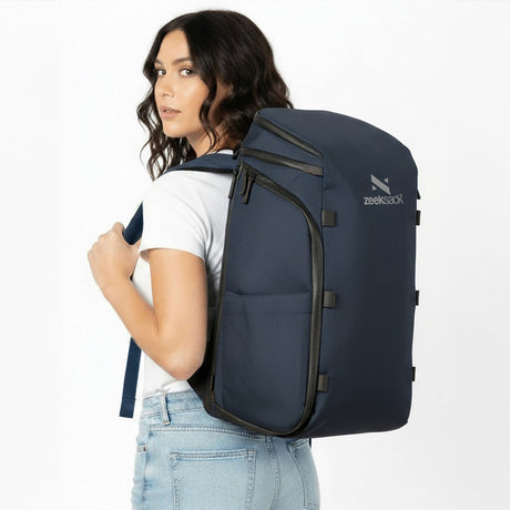 Woman wearing a navy blue backpack.