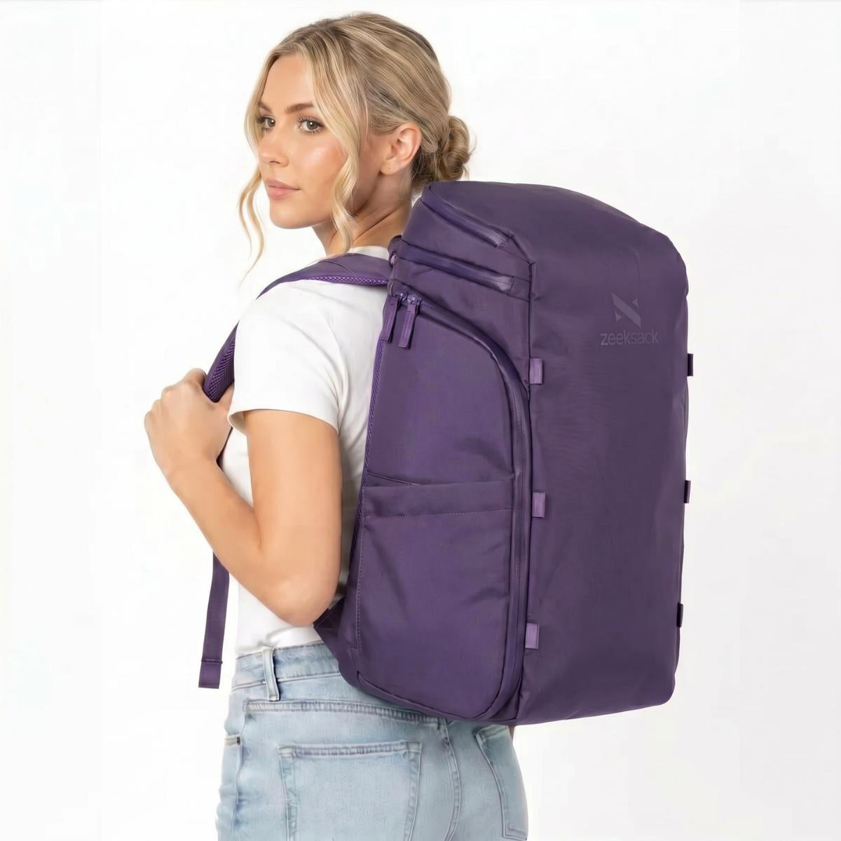Woman wearing a purple backpack.