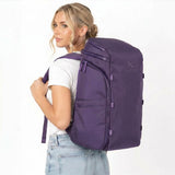 Woman wearing a purple backpack.