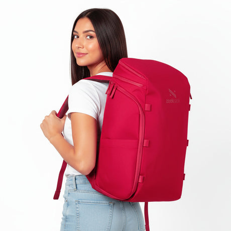 Woman wearing a red backpack.